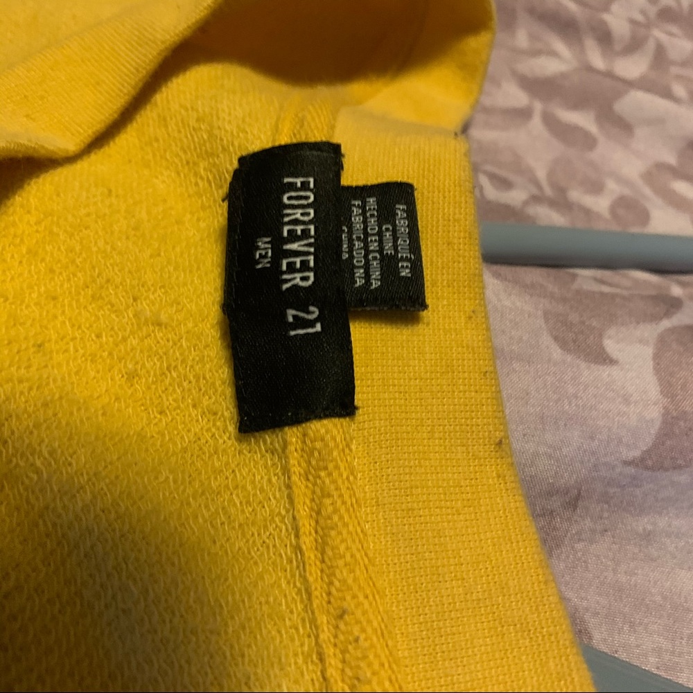 yellow shirt wit a little rose